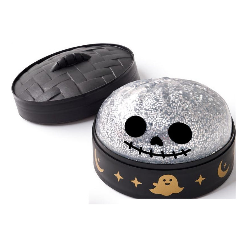 Silver skeleton dumpling squishy in steamer-style storage case